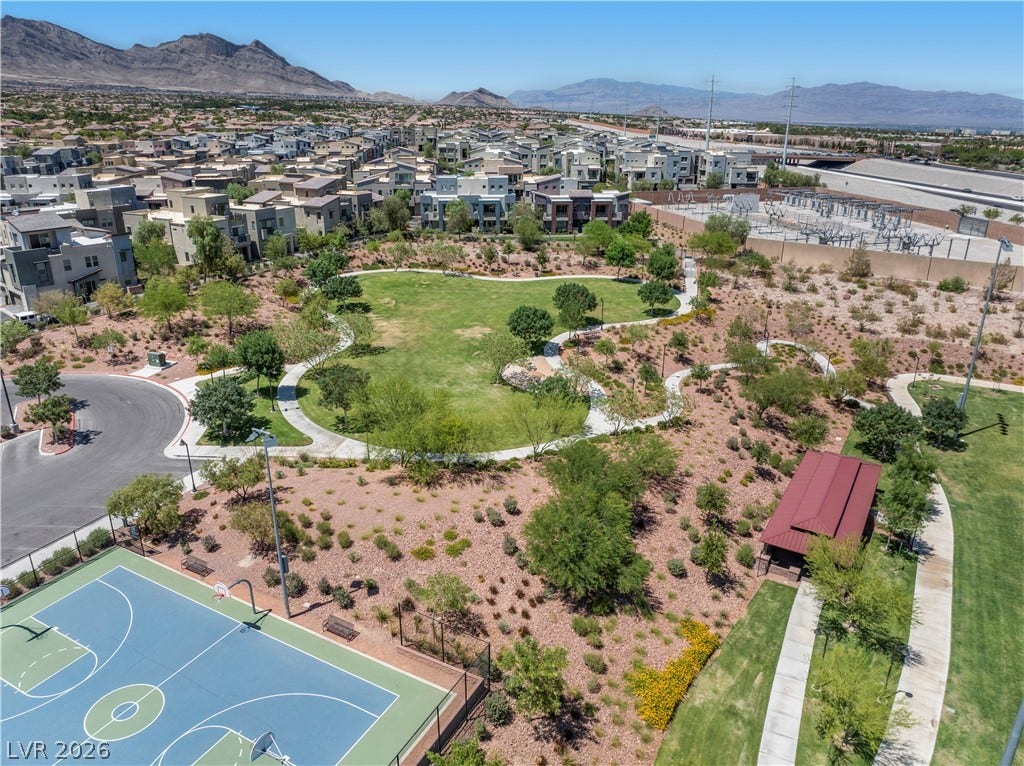926 Loma Bonita Place, Las Vegas, NV 89138 Expansive community green spaces and recreational courts lie just steps from the residences.