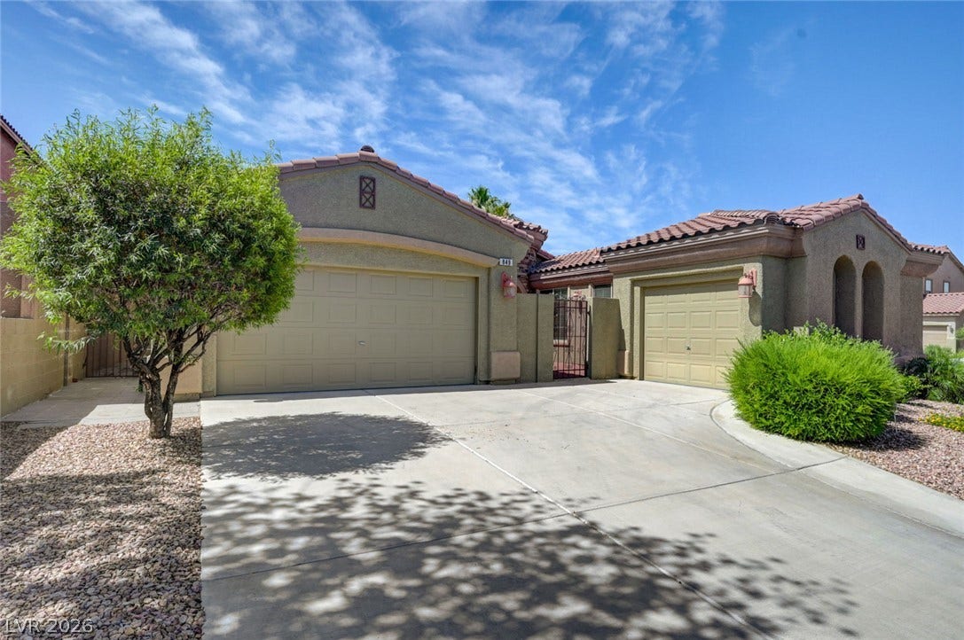 849 Ashford Way, Henderson, NV 89015 Two garages and an inviting concrete driveway enhance this property's curb appeal.