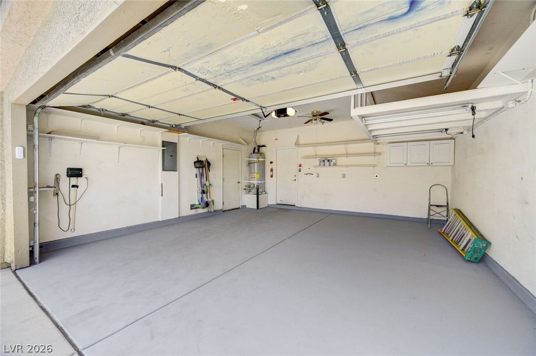 849 Ashford Way, Henderson, NV 89015 Ample garage space with durable flooring and convenient overhead storage options.