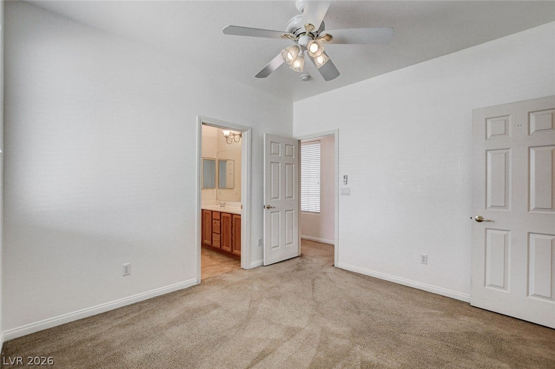 849 Ashford Way, Henderson, NV 89015 Comfortable carpeting and a ceiling fan create a relaxing ambiance in this adaptable bedroom space.