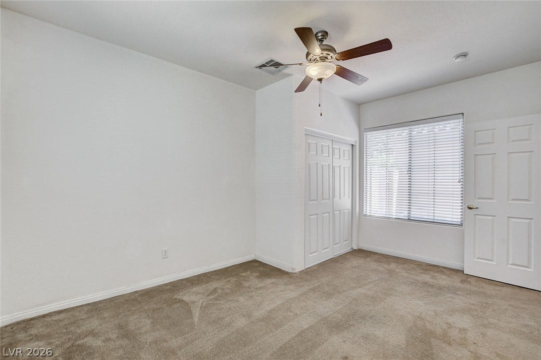 849 Ashford Way, Henderson, NV 89015 Well-lit sleeping quarters with plush carpeting and a convenient closet.