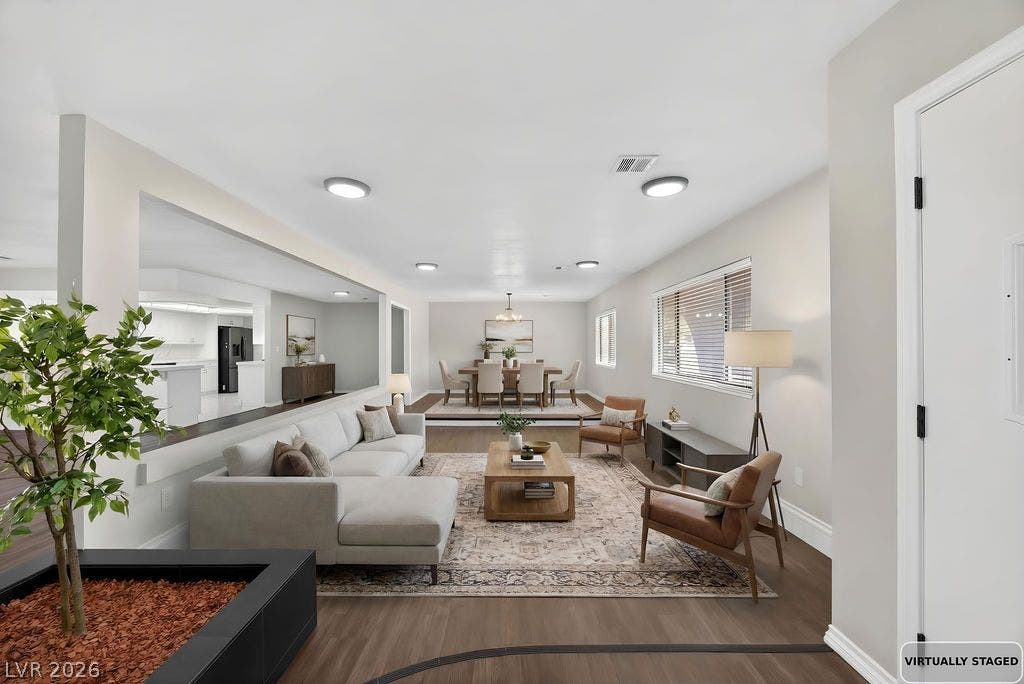 3189 Casanova Circle, Las Vegas, NV 89120 STAGED- An open floorplan seamlessly connects the airy living area with the dining space.
