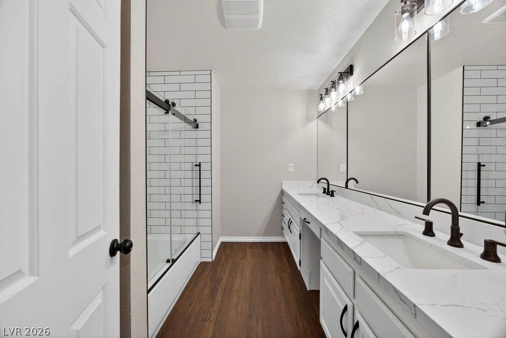 3189 Casanova Circle, Las Vegas, NV 89120 2nd Bath in hallway Rich wood flooring pairs elegantly with quartz countertops and clean subway tile detailing.