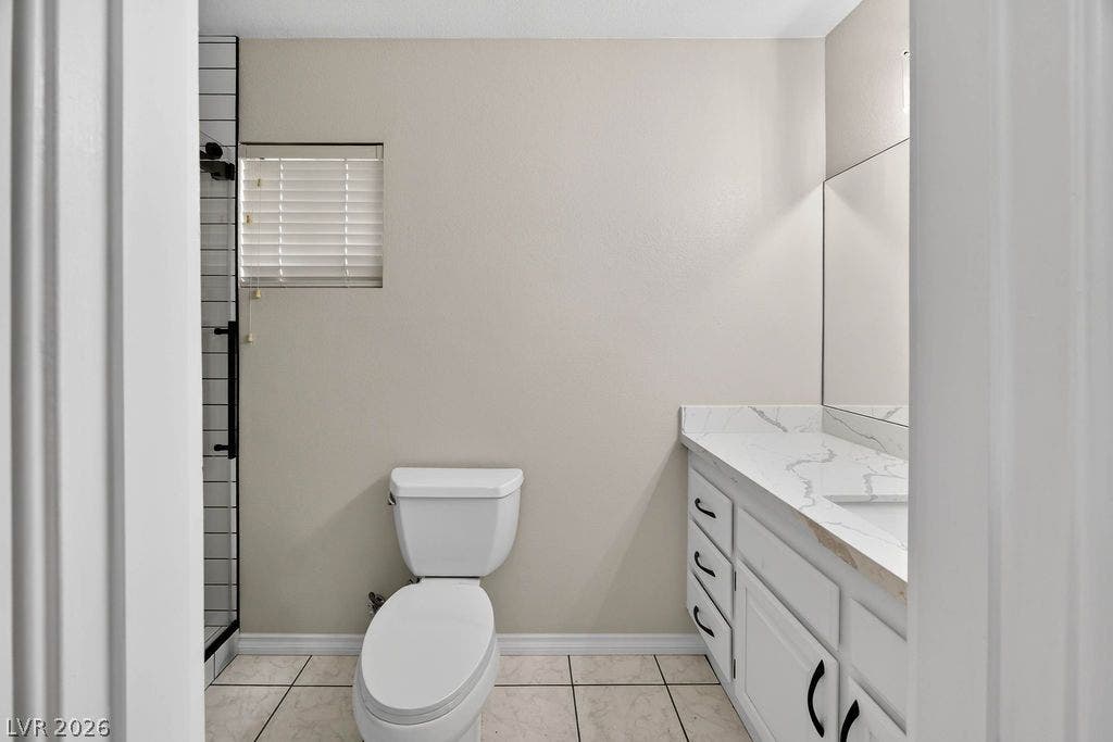 3189 Casanova Circle, Las Vegas, NV 89120 Guest 3/4 bathroom Clean tile flooring and a stone vanity top define this updated bathroom space.