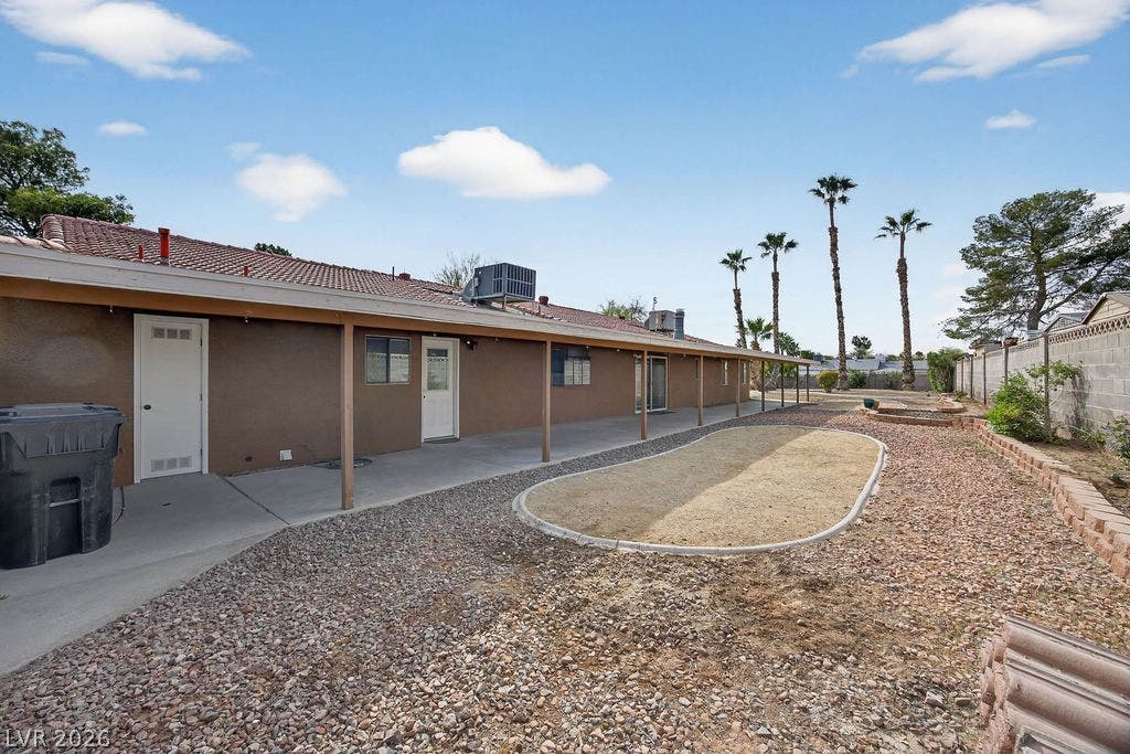 3189 Casanova Circle, Las Vegas, NV 89120 A long covered patio overlooks the low-maintenance desert landscaping in this spacious backyard.