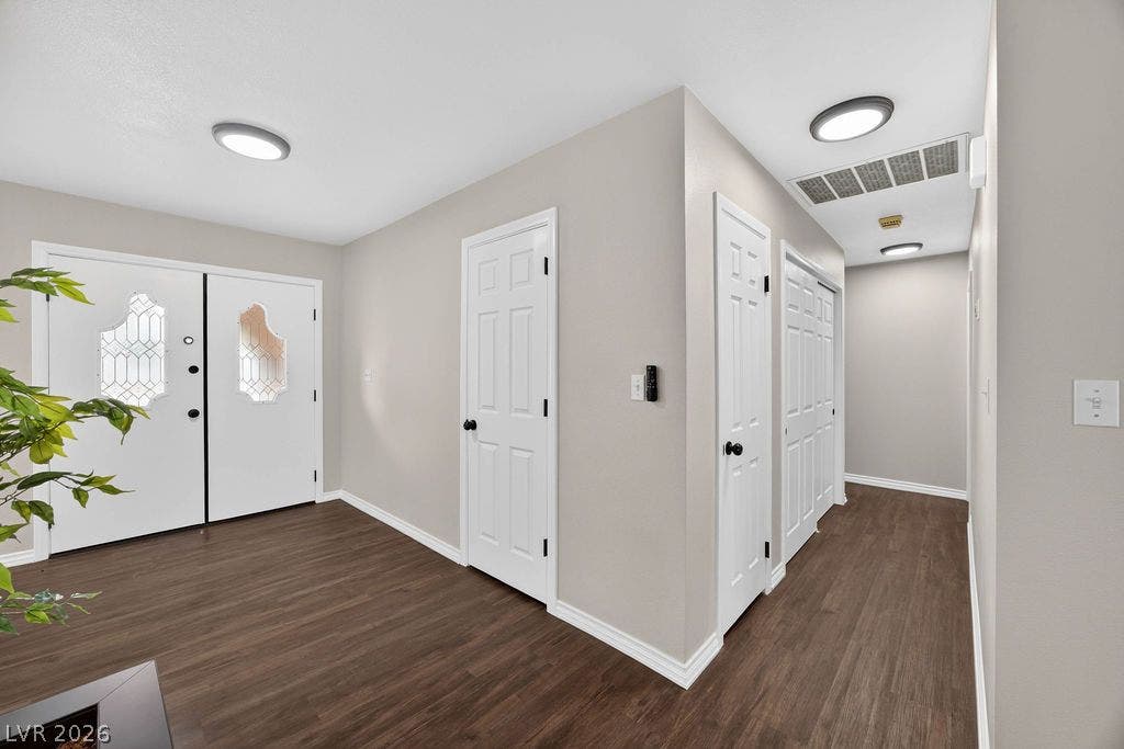 3189 Casanova Circle, Las Vegas, NV 89120 Rich wood flooring contrasts with crisp white trim in this welcoming entryway.