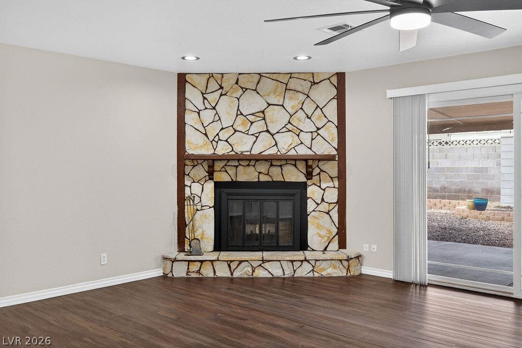 3189 Casanova Circle, Las Vegas, NV 89120 Rich wood floors anchor this inviting living space anchored by a dramatic stone fireplace.