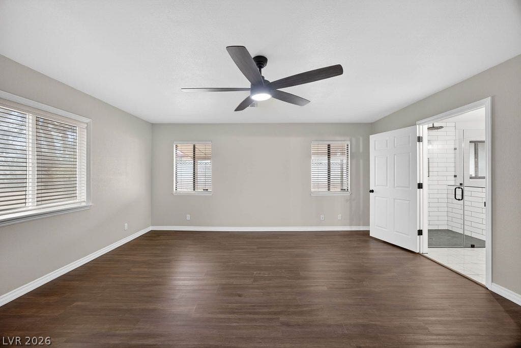 3189 Casanova Circle, Las Vegas, NV 89120 Rich wood-inspired floors and abundant natural light define this master bedroom suite.