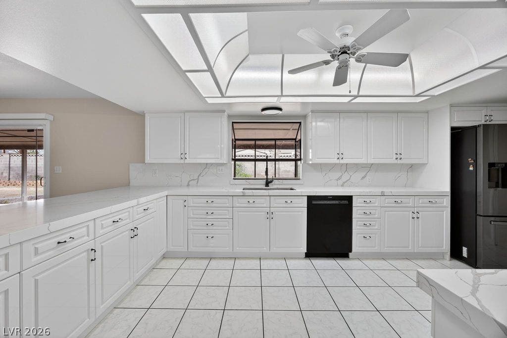 3189 Casanova Circle, Las Vegas, NV 89120 White cabinetry paired with stone countertops defines this well-designed culinary space.