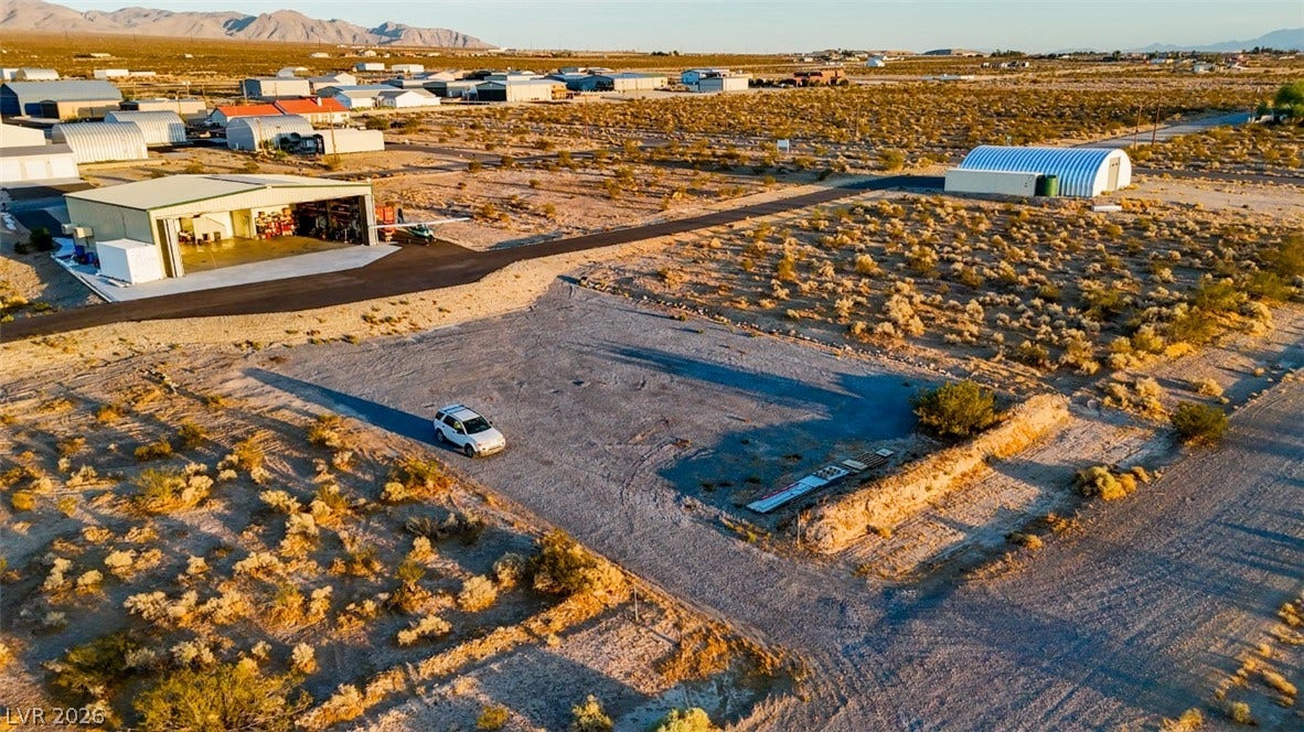 Vast desert acreage offers expansive mountain views and unlimited potential for custom development.
