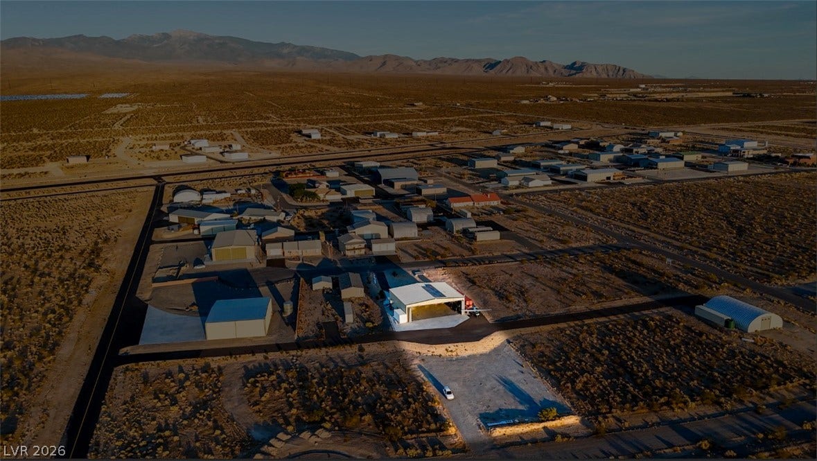 Rugged desert plains meet majestic mountain vistas under expansive western skies.