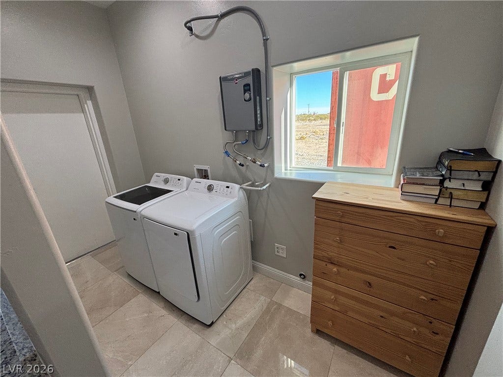 Polished tile flooring and an abundance of natural light define this functional utility space.