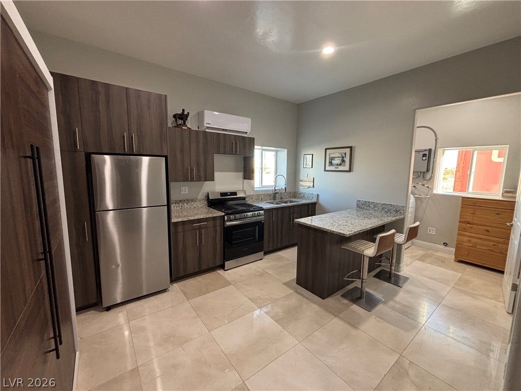 Granite countertops and clean tile floors ground this highly functional cooking space.
