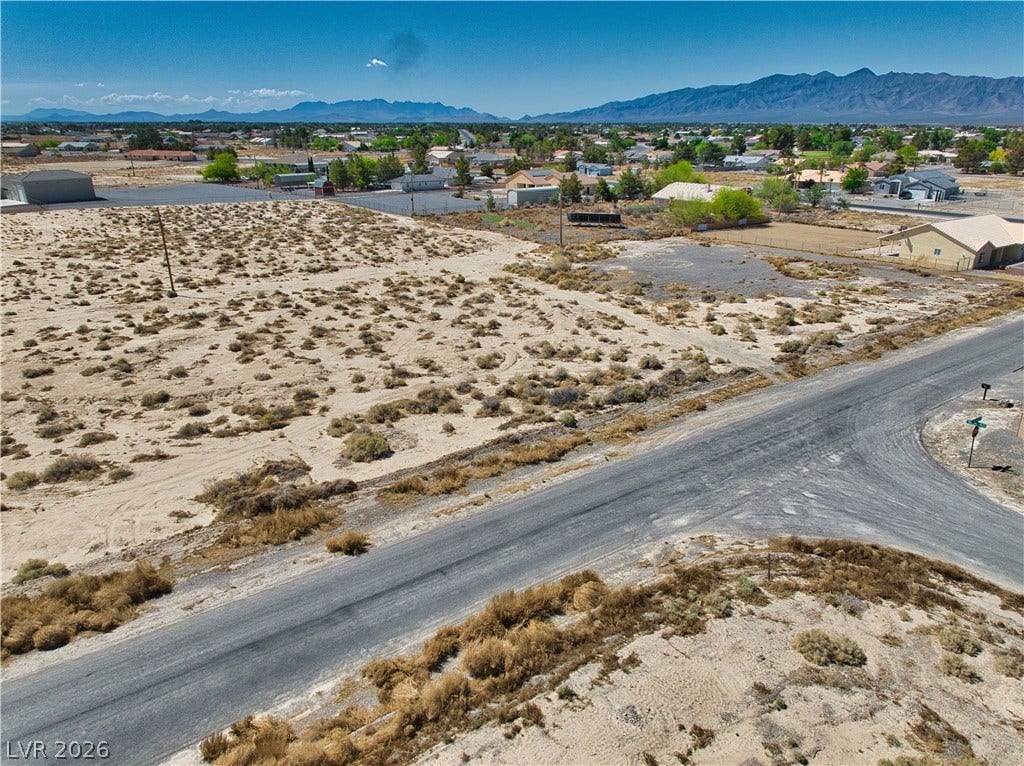 Property view of mountains with a residential view