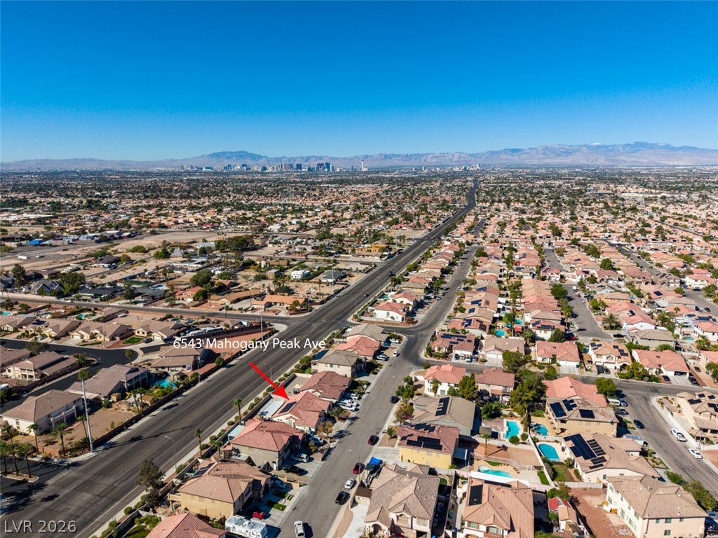 6543 Mahogany Peak Avenue, Las Vegas, NV 89110 Sweeping suburban vistas unfold toward the distant skyline under clear desert skies.