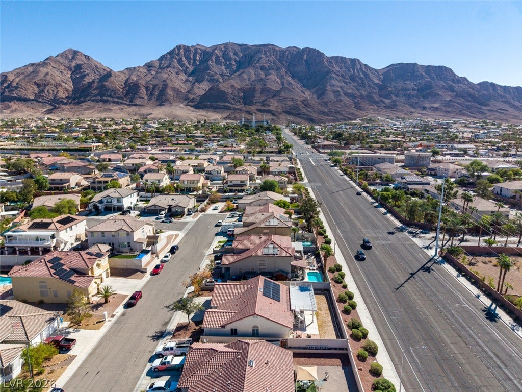 6543 Mahogany Peak Avenue, Las Vegas, NV 89110 A quiet residential neighborhood lies nestled beneath towering mountain peaks.