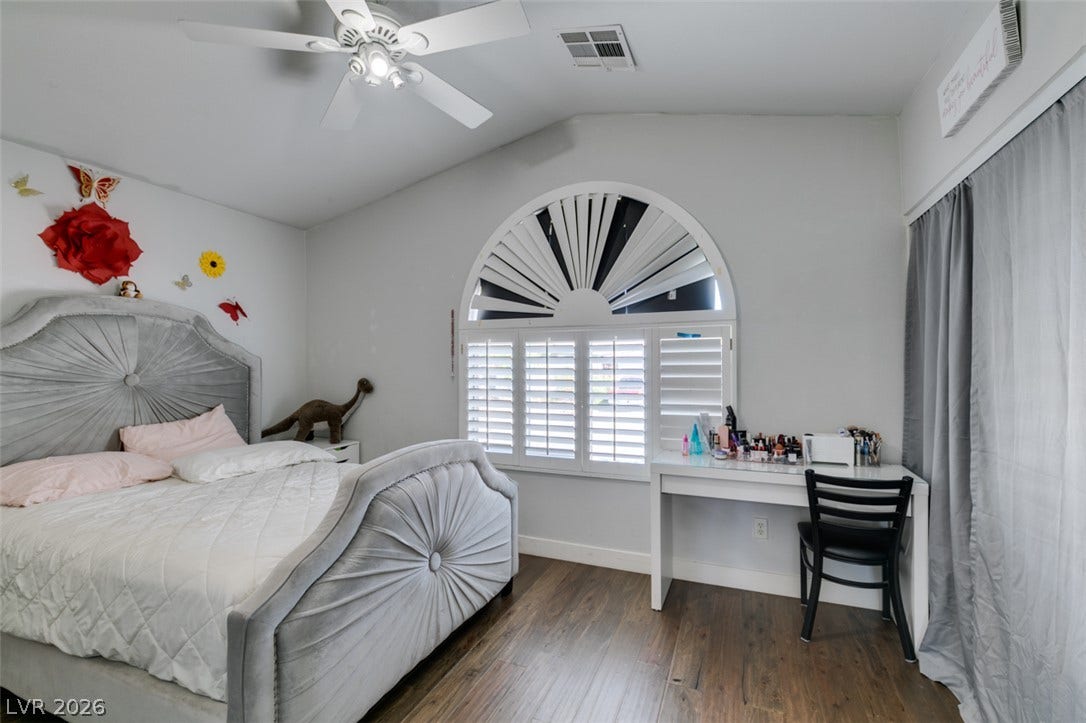 6543 Mahogany Peak Avenue, Las Vegas, NV 89110 Vaulted ceilings and rich wood floors define this bright architectural space. Bedroom #2