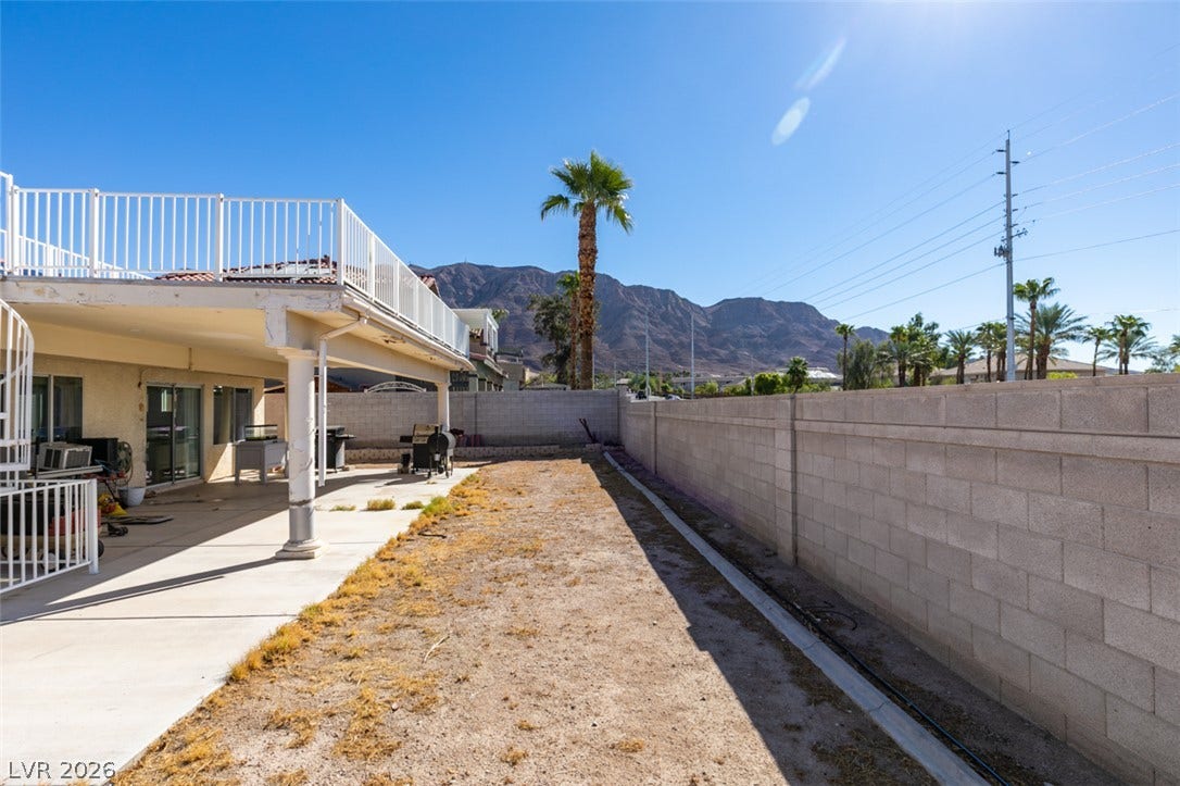6543 Mahogany Peak Avenue, Las Vegas, NV 89110 Majestic mountain views frame the walled backyard complete with a spacious covered patio.