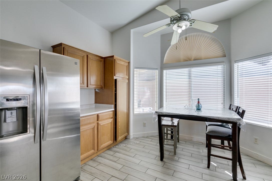 6543 Mahogany Peak Avenue, Las Vegas, NV 89110 High ceilings and wood-look tile flooring frame this inviting breakfast area off the kitchen.