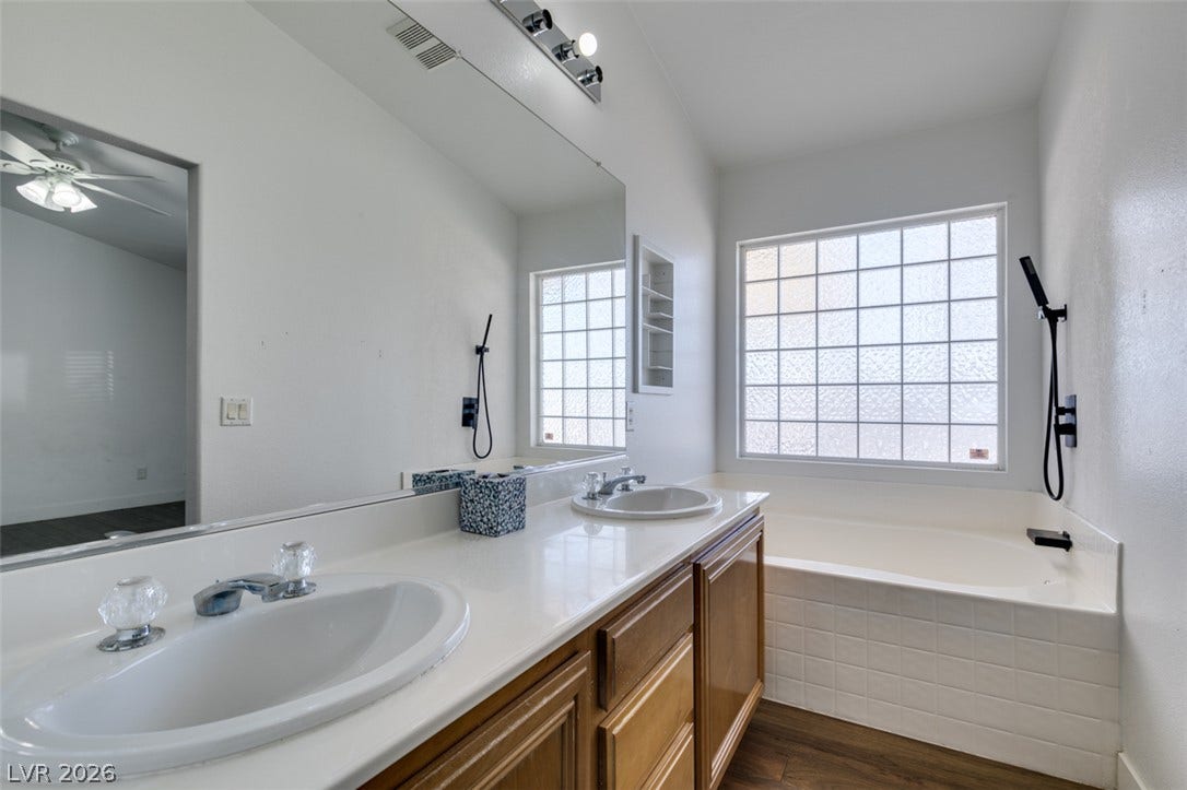 6543 Mahogany Peak Avenue, Las Vegas, NV 89110 Double vanity and a soaking tub.