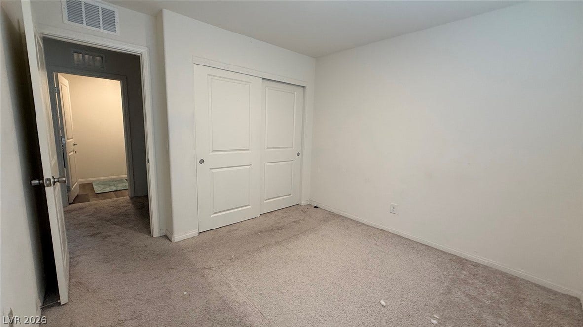 10079 Vibrant Moon Avenue, Las Vegas, NV 89129 Soft carpeting underfoot defines this versatile bedroom complete with integrated sliding closet doors.