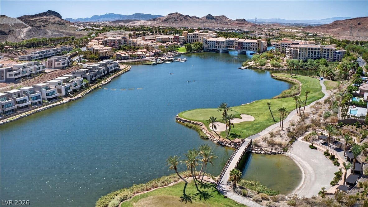 4 Bobado Lane, Henderson, NV 89011 A scenic lakeside community features lush fairways and desert mountain backdrops.