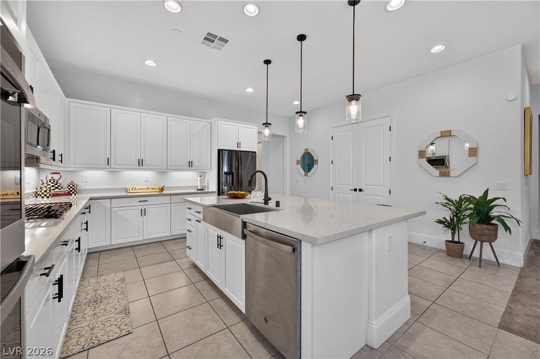 4 Bobado Lane, Henderson, NV 89011 Recessed lighting and a spacious center island anchor this beautifully appointed modern kitchen.