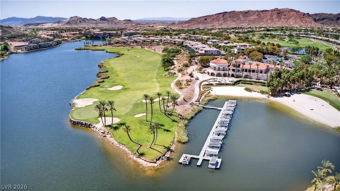 4 Bobado Lane, Henderson, NV 89011 Lush golf fairways and a private marina sit along the water's edge below rugged mountains.