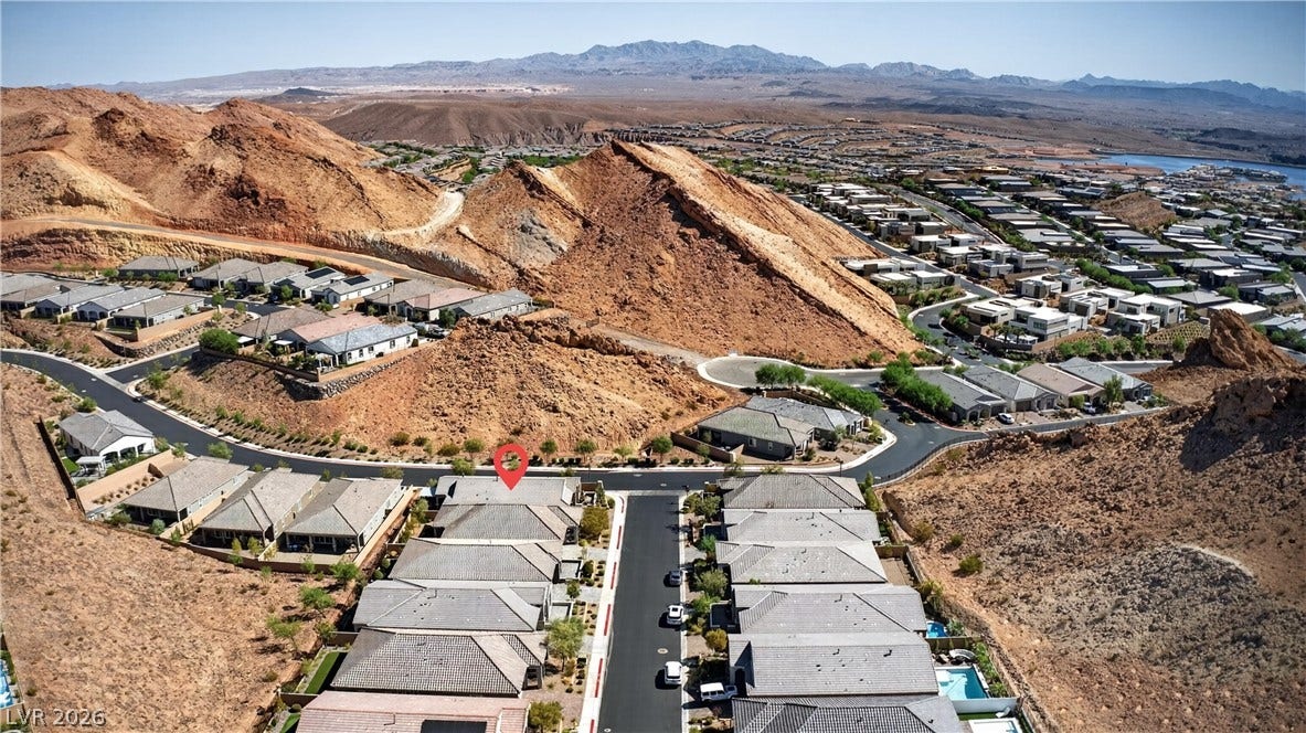 4 Bobado Lane, Henderson, NV 89011 Rugged desert hills cradle this hillside neighborhood under vast open skies.
