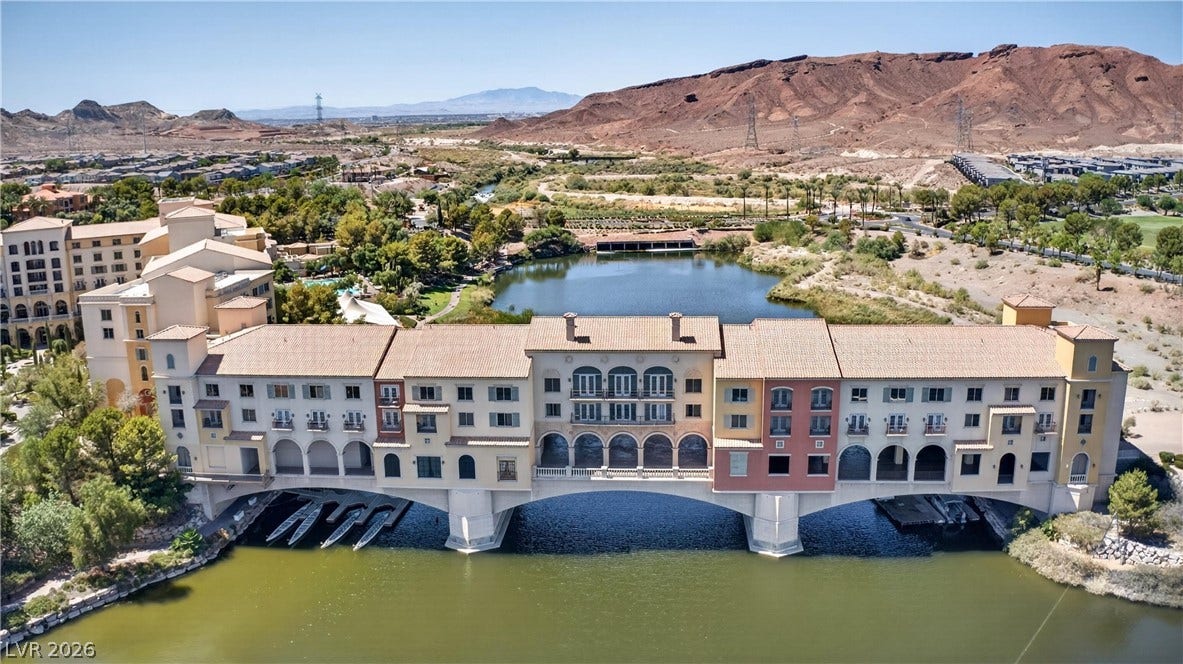 4 Bobado Lane, Henderson, NV 89011 Dramatic mountain vistas frame this waterfront architectural landmark spanning the tranquil lake.
