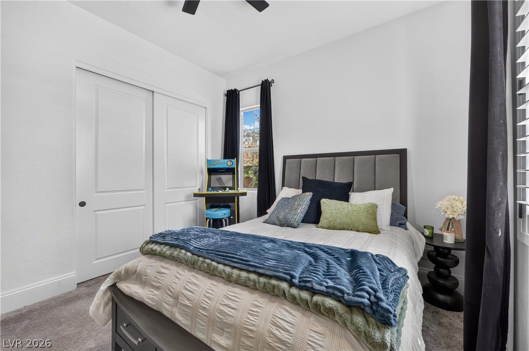 4 Bobado Lane, Henderson, NV 89011 Smooth carpeting pairs with tall baseboards in this well-proportioned bedroom.