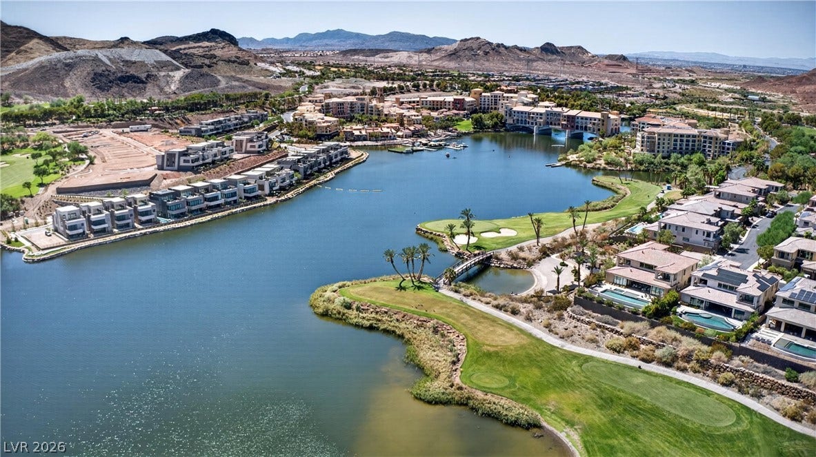 4 Bobado Lane, Henderson, NV 89011 Lakeside living meets manicured fairways set against a dramatic mountain backdrop.