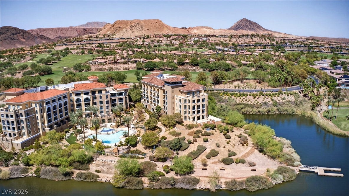 4 Bobado Lane, Henderson, NV 89011 Dramatic mountain vistas rise behind this lakeside resort property surrounded by lush fairways.