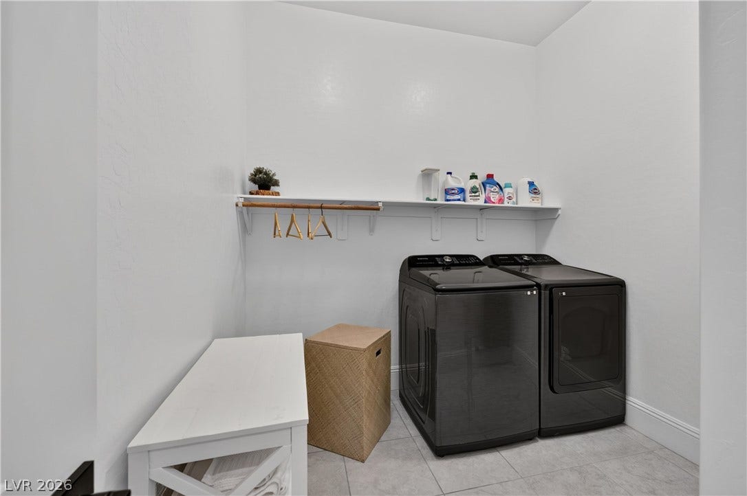 4 Bobado Lane, Henderson, NV 89011 Functional tile flooring and built-in shelving maximize organization in this dedicated utility space.