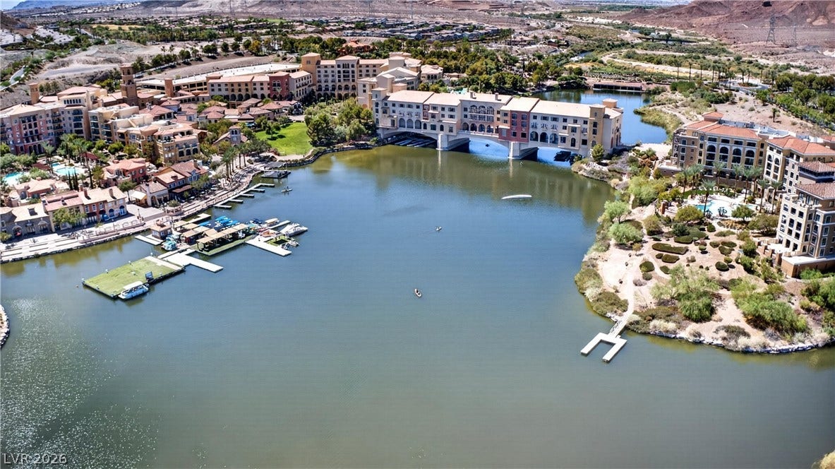4 Bobado Lane, Henderson, NV 89011 A quiet resort community centers around a calm blue lake under open desert skies.