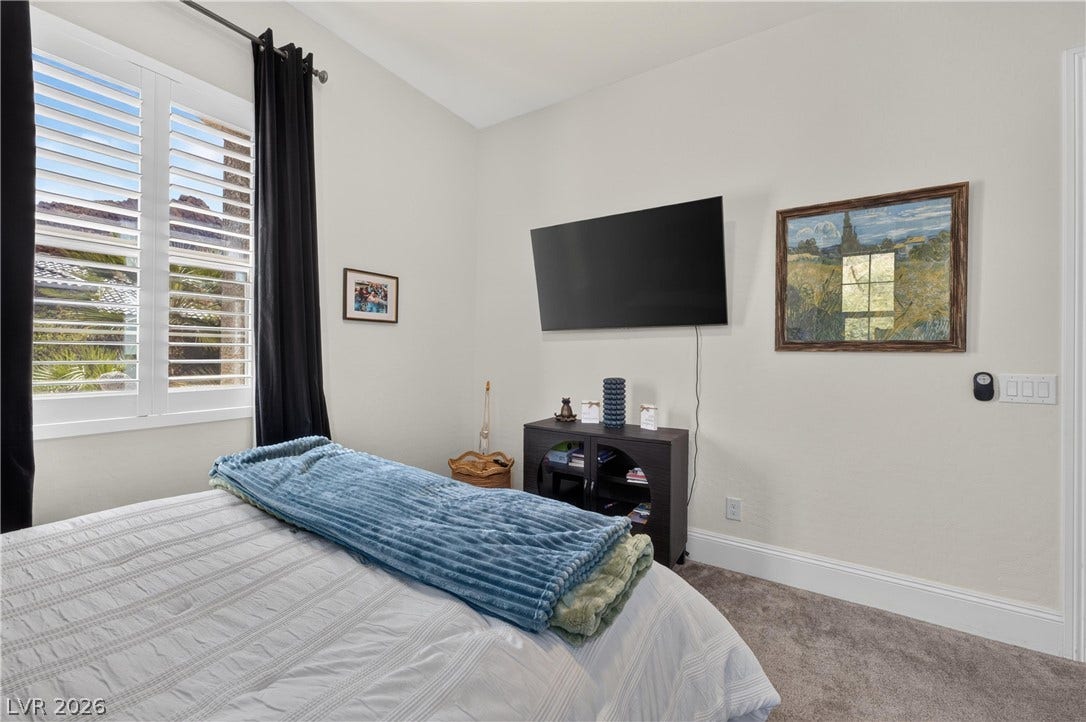 4 Bobado Lane, Henderson, NV 89011 Plentiful natural light streams through plantation shutters onto plush carpeted flooring.