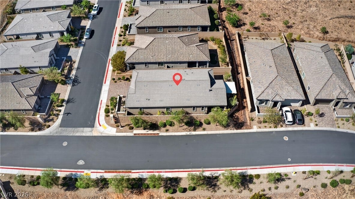 4 Bobado Lane, Henderson, NV 89011 An aerial perspective showcases the well-structured suburban neighborhood and tile roofing.