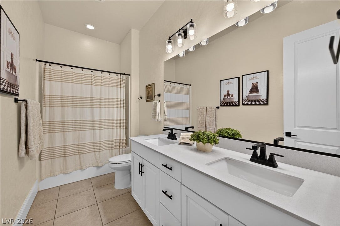 4 Bobado Lane, Henderson, NV 89011 Clean lines and a spacious dual vanity define this updated bathroom.
