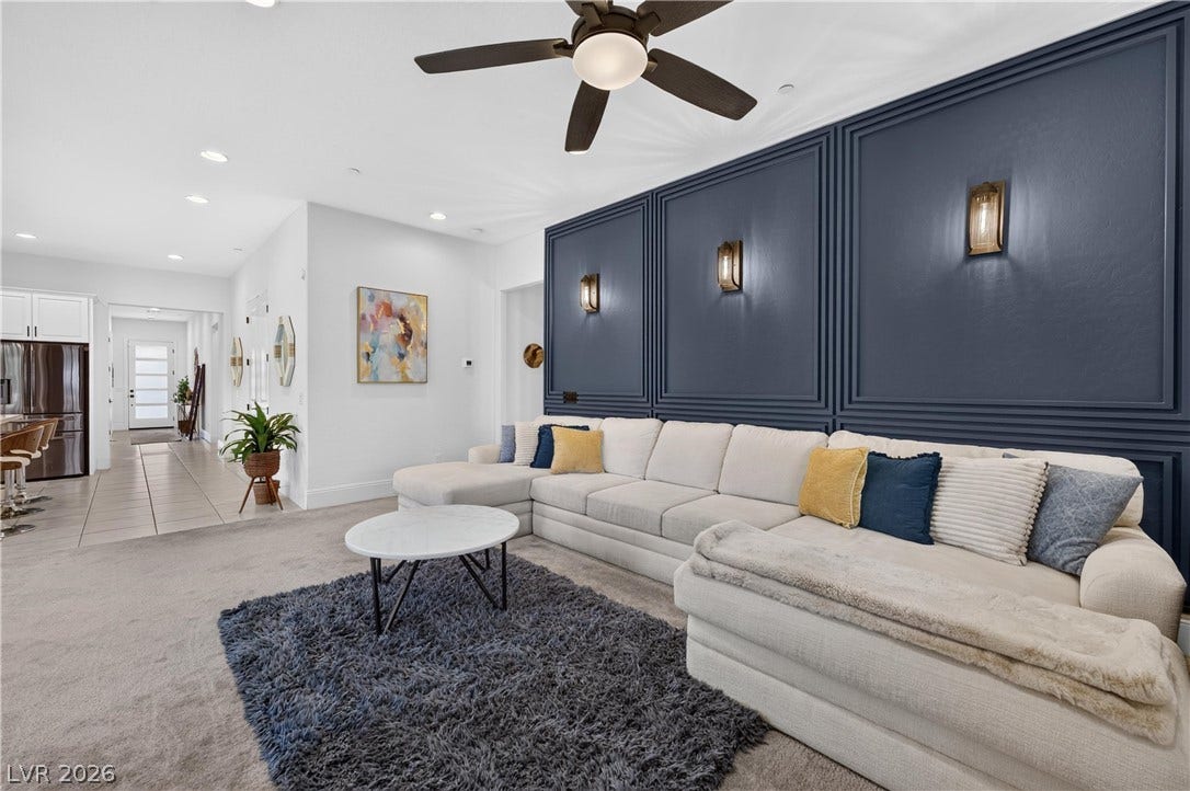 4 Bobado Lane, Henderson, NV 89011 Rich wall paneling and recessed lighting elevate this comfortable, open living space.