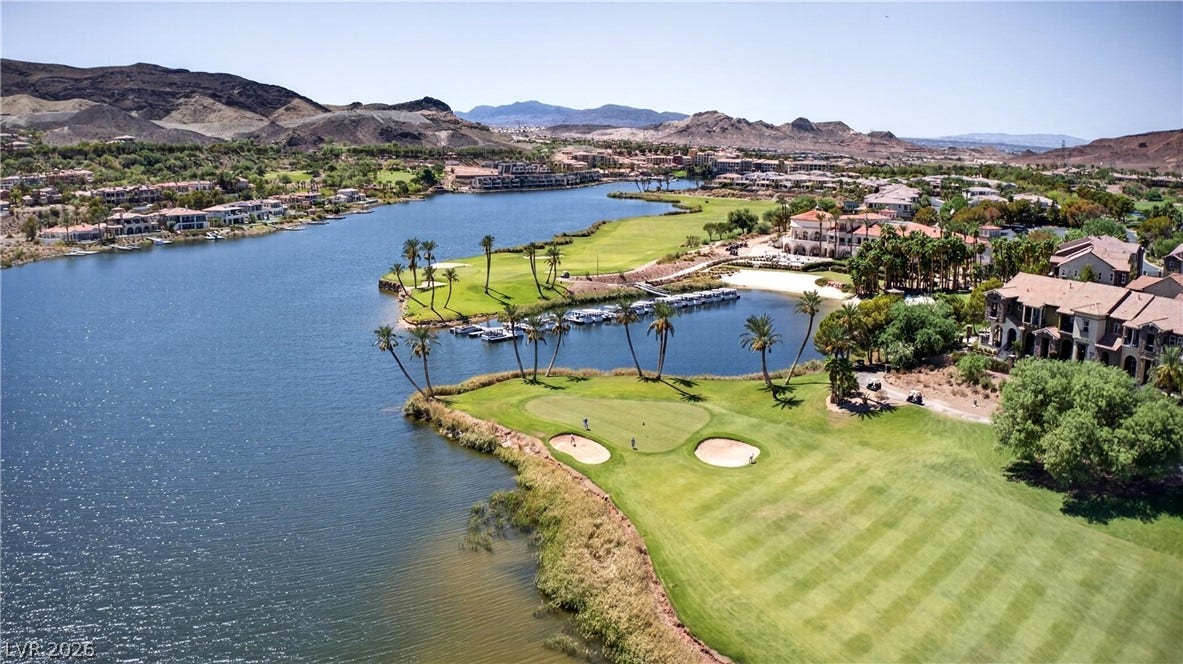 4 Bobado Lane, Henderson, NV 89011 Panoramic mountain and water vistas surround the manicured fairways of this lakeside community.