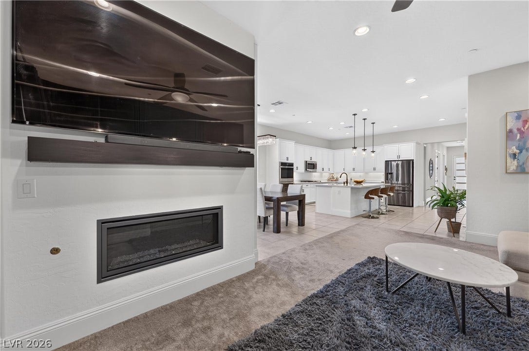 4 Bobado Lane, Henderson, NV 89011 An open floorplan seamlessly connects the living space with a modern kitchen.