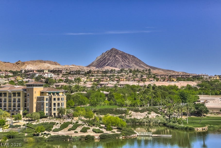 4 Bobado Lane, Henderson, NV 89011 Sweeping mountain and water views provide a serene backdrop for this desert landscape.