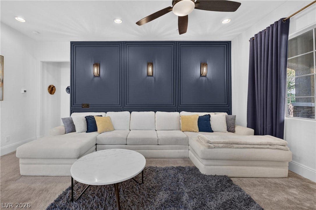 4 Bobado Lane, Henderson, NV 89011 Richly paneled wall molding paired with classic carpeting creates a refined architectural backdrop.