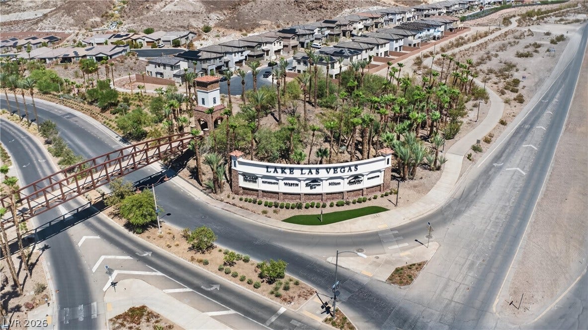 4 Bobado Lane, Henderson, NV 89011 A prominent neighborhood entry sign anchors this beautifully landscaped master-planned community entrance.