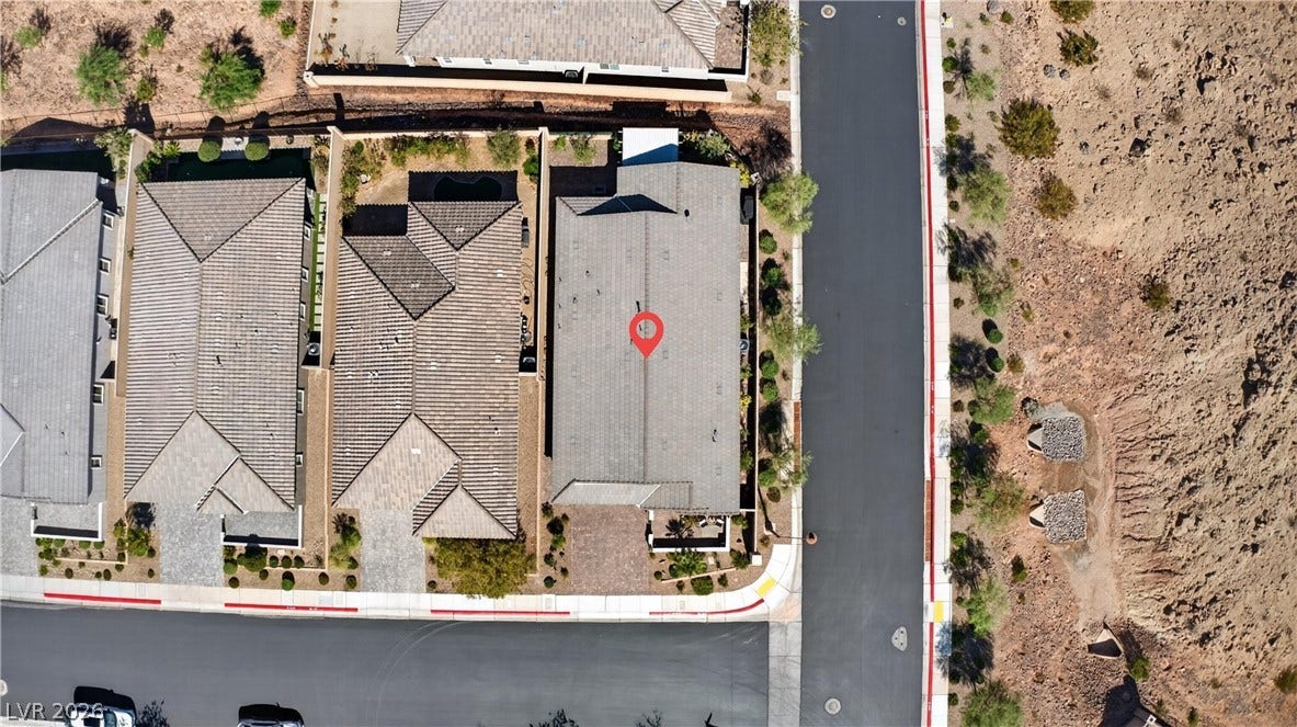 4 Bobado Lane, Henderson, NV 89011 An aerial perspective showcases the property roofline and neighboring residential community layout.