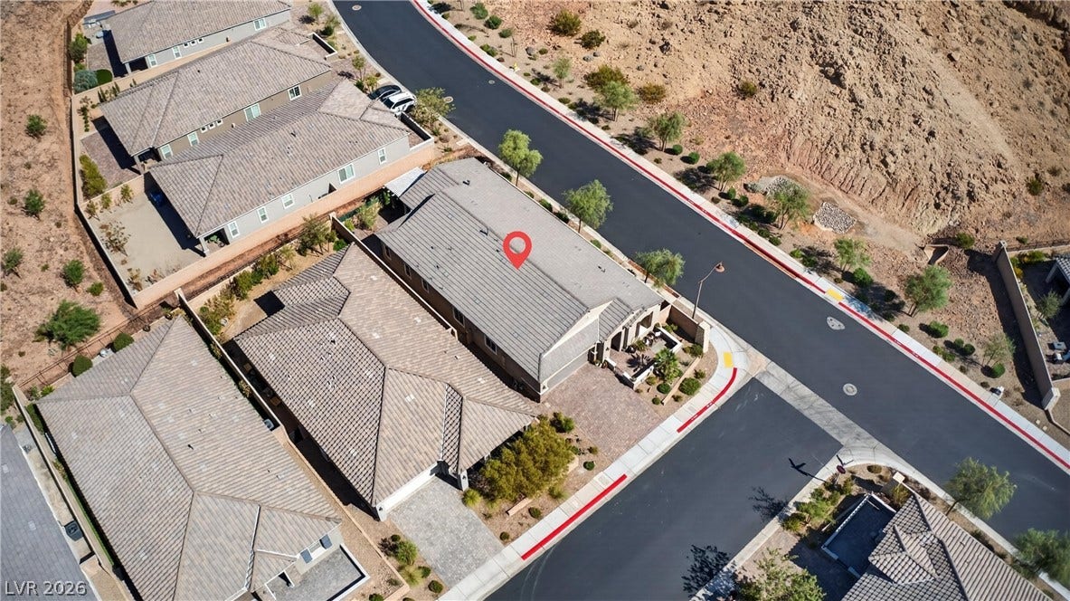 4 Bobado Lane, Henderson, NV 89011 Aerial view highlights the tiled rooflines and desert landscaping of this neighborhood.