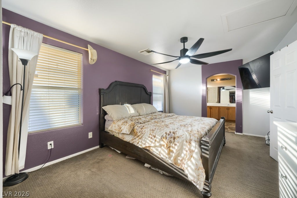 2099 Lost Maple Street, Las Vegas, NV 89115 Plentiful natural light streams across a comfortable layout with textured carpeting.