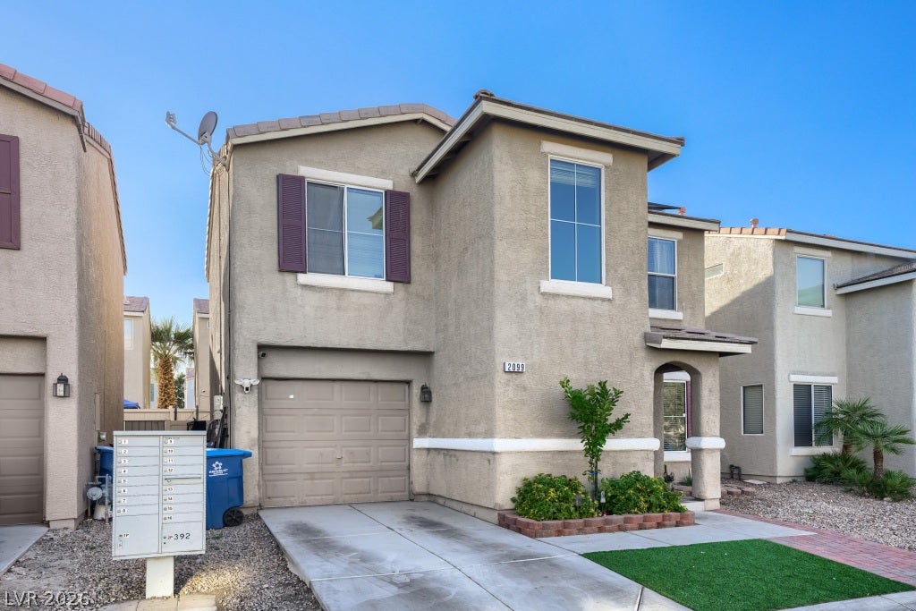 2099 Lost Maple Street, Las Vegas, NV 89115 Clean lines and a neat driveway define the front exterior of this modern home.