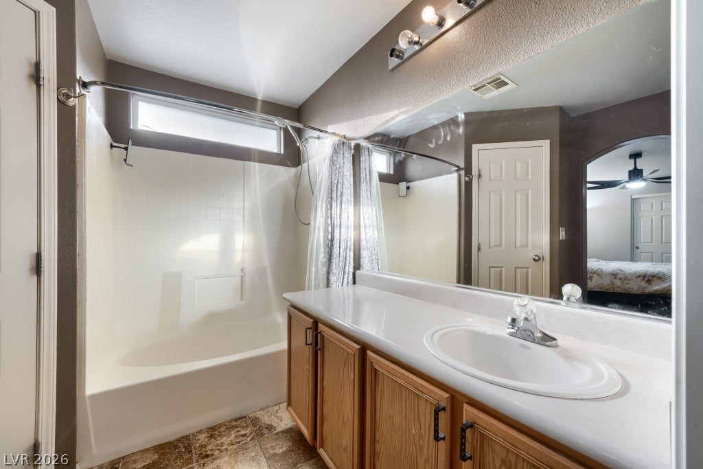 2099 Lost Maple Street, Las Vegas, NV 89115 A classic bathroom featuring a generous vanity and tile flooring.