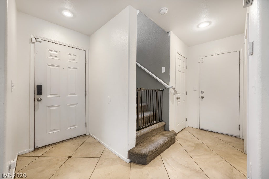 2099 Lost Maple Street, Las Vegas, NV 89115 Durable tile flooring and a neutral color scheme define this functional entry hall.